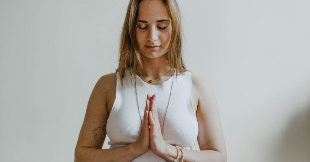 A serene image of a woman practicing meditation indoors, promoting mindfulness and wellbeing.